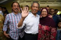 Malaysia's new Prime Minister Muhyiddin Yassin (C), pictured with his wife Noraini Abdul Rahman, heads a coalition dominated by the multi-ethnic country's Muslim majority and has faced criticism for controversial remarks about race (AFP Photo/Mohd RASFAN) 