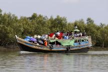 People travelling by boat in Sittwe, Rakhine State, western Myanmar. Photo: Nyein Chan Naing/EPA