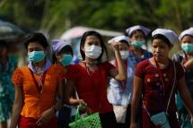 Myanmar workers wearing protective face masks. Photo: EPA