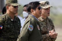 Philippine President Ferdinand Marcos Jr. (C), is joined by Chief-of-Staff of the Armed Forces of Philippines Andres Centino (L) and United States Army Lieutenant Colonel Timothy Lynch (R) during a briefing for the Philippines-US 38th Balikatan Exercises at Naval Station Leovigildo Gantioqui in Zambales province, north of Manila, Philippines, 26 April 2023. Photo: EPA