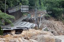 A road is destroyed due to the floods near the Kuma river in Ashikita, Kumamoto prefecture, Japan, 06 July 2020. Photo: EPA