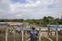 (FILES) This file photo taken on August 24, 2018 shows Myanmar border guard police patrol watching over Rohingya refugees settlement in the "no man's land" zone between Myanmar and Bangladesh border as seen from Maungdaw, Rakhine state. Photo: Pyo Hein Kyaw/AFP