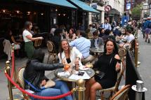 People enjoy a day in a restaurant in Soho London, Britain, 04 July 2020. Photo: EPA
