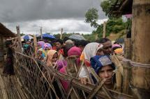 In this file photo taken on August 12, 2018 Rohingya refugees queue at an aid relief distribution centre at the Balukhali refugee camp near Cox's Bazar. Photo: Ed Jones/AFP