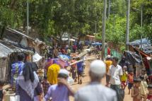 Rohingya refugees walk along a makeshift camp in Kutubpalang, Ukhiya Cox Bazar district, Bangladesh. Photo: EPA