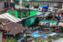 A man (C) checks his damaged house by cyclone Mocha in Sittwe in Myanmar's Rakhine state on May 17, 2023. Photo: AFP