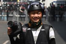 This picture taken on February 26, 2021 shows Associated Press (AP) photographer Thein Zaw posing for a photo during his coverage of demonstrations by protesters against the military coup in Yangon, a day before he was arrested. Photo: AFP
