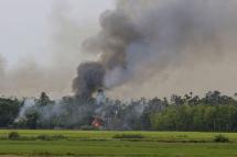 (File) Smoke and flames rise from the Gawdu Thara village in Maungdaw township, Rakhine State, western Myanmar, 07 September 2017. Photo: Nyein Chan Naing/EPA