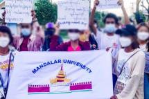 Mandalar University students holding posters as they march during an anti-military coup protest in Mandalay, Myanmar on August 07. Photo: CJ