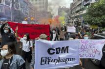 (File) Demonstrators holding posters and banners march during an anti-military coup protest at downtown area in Yangon, Myanmar, 26 June 2021. Photo: EPA