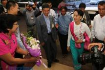 Myanmar opposition leader Aung San Suu Kyi arrives at Yangon International Airport ahead of her departure for China, in Yangon on June 10, 2015. Photo: Thet Ko/Mizzima
