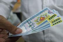 Ten thousand Myanmar Kyat notes. Photo: Ye Aung Thu/AFP