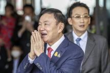 Former Thai prime minister Thaksin Shinawatra, accompanied by his son Panthongtae Shinawatra, greets supporters and journalists upon his arrival at Don Mueang airport in Bangkok, Thailand, 22 August 2023. Photo: EPA