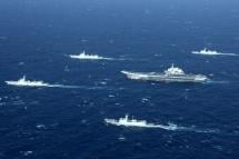 A Chinese navy formation, including the aircraft carrier Liaoning (C), during military drills in the South China Sea. Photo: AFP