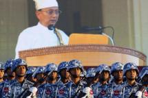 President U Thein Sein delivers a speech as seen on a background display as Myanmar Airforce soldiers participate in a ceremony to mark the 67th anniversary of Myanmar's Independence day, in Nay Pyi Taw, Myanmar, January 4, 2015. Photo: Lynn Bo Bo/EPA
