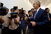Questions have been raised about the visits of the former UK prime minister to Myanmar. Mr Tony Blair (R), former Prime Minister of United Kingdom, shows a thumb up as he walks out of the 22nd World Economic Forum in Nay Pyi Taw  2013. Photo: Nyein Chan Naing/EPA
