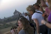 Tourists wait to watch sunset over the pagodas in Myanmar's northern ancient town of Bagan . Photo: AFP
