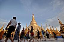 A group of western tourists visit on the platform of the Shwedagon pagoda in Yangon, Myanmar. Photo: Nyein Chan Naing/EPA
