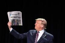 (FILE) - US President Donald J. Trump holds a copy of the USA Today newspaper fronting with his impeachment acquittal, as he arrives to the 68th Annual National Prayer Breakfast in Washington, DC, USA, 06 February 2020. Photo: EPA