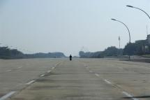 A motorbike drives along an empty 20-lane road in Naypyidaw, Myanmar. Photo: EPA
