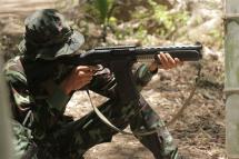 This undated photo taken in May 2021 shows an anti-coup activist undergo basic military training with a weapon at the camp of Karen National Union (KNU) in Karen State, Myanmar. Photo: AFP