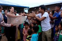 US actress and UNHCR Goodwill Ambassador Angelina Jolie (C) greets with Kachin refugees at Janmai Baptist camp, Myitkyina, Kachin State, Myanmar, 30 July 2015. Angelina Jolie is on her six days visit to Myanmar as UNHCR Goodwill Ambassador. Angelina Jolie met Myanmar President and speakers of Myanmar Parliaments in Naypyitaw and also planned to visit IDPs camps during her visit. Photo: Myitkyina News Journal/EPA
