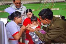 A UNICEF nurse injecting a child. Photo: UNICEF