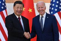 US President Joe Biden (R) and China's President Xi Jinping (L) shake hands as they meet on the sidelines of the G20 Summit in Nusa Dua on the Indonesian resort island of Bali on November 14, 2022. Photo: AFP