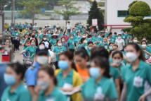 This picture taken on November 30, 2022 shows workers leaving their workplace at Taiwanese Ty Hung factory in Ho Chi Minh City. Photo: AFP