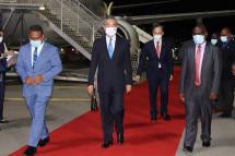This picture taken on May 25, 2022, shows Solomon Island's Foreign Minister Jeremiah Manele (L) and Chief Protocole Walter Diamana (R) escorting Chinese Foreign Minister Wang Yi (C) upon his arrival at the Henderson International Airport in Honiara. Photo: AFP