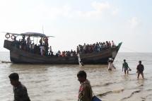 people getting off a boat in Bhashan Char island off the Bangladeshi coast, as it was being prepared for the relocation of Rohingya refugees living in the country's south after fleeing violence in neighbouring Myanmar. Photo: AFP