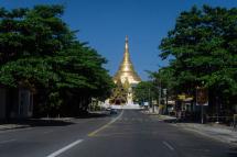 An empty street is pictured near Shwedagon Pagoda, as demonstrators called for a "silent strike" in protest against the military coup, in Yangon. Photo: AFP