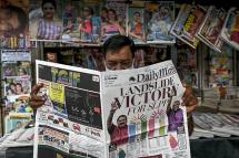 In this file photo, a man reads a local newspaper covering the results of Sri Lanka's parliamentary elections in Colombo on August 7, 2020. Photo: AFP