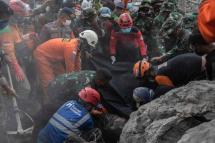 Rescue workers in Indonesia continued to dig through thick layers of hot ash and debris on Tuesday to find survivors of a volcanic eruption that left dozens of people dead and thousands displaced in the country's East Java province. Photo: AFP 