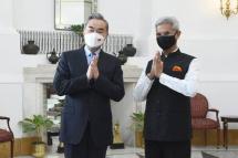 In this photo provided by Indian Foreign Minister S. Jaishankar's Twitter handle, Jaishankar and his Chinese counterpart Wang Yi greet the media before their meeting in New Delhi, India, Friday, March 25, 2022. Photo: DrSJaishankar / Twitter 