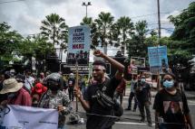 Papuan students hold a protest against the Indonesian government's plan to develop new administrative areas in the country's easternmost Papua province, in Surabaya on Tuesday. Photo: AFP