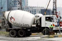 Employees of Holcim Indonesia, a unit of Swiss cement giant Holcim Ltd, work at the factory in Jakarta. Photo: AFP