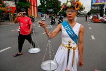 In this file photo taken on May 3, 2022, Theary Seng (R), a US-Cambodian lawyer and activist then facing treason and incitement charges, walks in the street in front of Phnom Penh municipal court ahead of her hearing in Phnom Penh. Photo: AFP