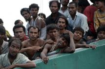 Rohingya migrant crying as he sits with others in a boat drifting in Thai waters off the southern island of Koh Lipe in the Andaman. Photo: AFP