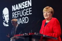 Germany’s former chancellor Angela Merkel delivers a speech during a ceremony to receive the UNHCR Nansen Refugee Award for protecting refugees at height of Syria crisis, in Geneva on October 10, 2022. Photo: AFP