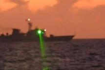 This handout photo taken on February 6, 2023 and released by the Philippine Coast Guard on February 13 shows a Chinese Coast Guard vessel shining a "military grade laser light" at a Philippine Coast Guard boat nearly 20 kilometres (12 miles) from Second Thomas Shoal, in the Spratly Islands in the disputed South China Sea. Photo: Philippine Coast Guard/AFP