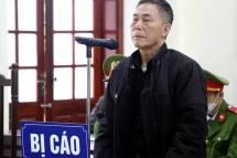 This picture taken and released by the Vietnam News Agency on December 15, 2020 shows Vietnamese writer Tran Duc Thach during his court trial in Vietnam's Nghe An province, as he was sentenced to 12 years in jail on charges of attempting to overthrow the government. Photo: Vietnam News Agency / AFP