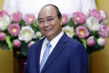 (FILE) - Vietnamese President Nguyen Xuan Phuc smiles at the Presidential Palace in Hanoi, Vietnam, 27 June 2022 (reissued 17 January 2023). Photo: EPA