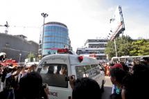 An ambulance carrying the body of bomb explosion victim drives out in Yangon, Myanmar, 21 December 2011. Photo: EPA