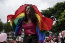A girl is seen dancing with the rainbow flag during the Pink Dot event held at the Speaker's Corner in Hong Lim Park, Singapore. Photo: EPA