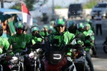 Indonesian motorbike taxi riders from Gojek Online Motorbike Taxi Company ride their vehicles during the Indonesian Archipelago Touring opening ceremony in Sabang, Aceh, Indonesia. Photo: EPA