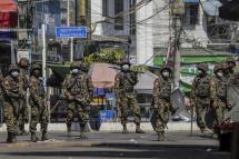 Soldiers patrol on the street during a protest against the military coup in Yangon, Myanmar. Photo: EPA