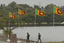 Sri Lankan Army solders patrol at the parliament complex during the ceremonial inauguration of the first session of the 9th parliament in Colombo, Sri Lanka, 03 August 2022.  Photo: EPA