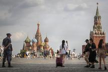 Russian tourists walk at the Red Square in Moscow, Russia, 03 August 2022 (issued 09 August 2022). Photo: EPA