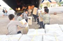 (File) Relief goods are loaded aboard the Tatmadaw aircraft to deliver them to storm-hit Rakhine State in May, 2023. Photo: GNLM